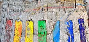 Abstract background. The concrete wall painted in colors of a ra