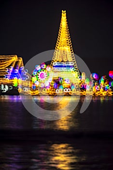 Abstract background with defocused bokeh of night festival in Prasamut Chedi Temple.