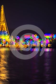 Abstract background with defocused bokeh of night festival in Prasamut Chedi Temple.