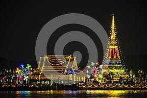 Abstract background with defocused bokeh of night festival in Prasamut Chedi Temple.