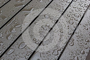 Abstract background drops of rain water on a wooden table