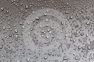 Abstract background drops of rain water on a wooden table