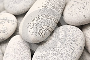 abstract background with dry round gray reeble stones gray close-up pebbles background spa relaxation concept