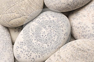 abstract background with dry round gray reeble stones gray close-up pebbles background spa relaxation concept