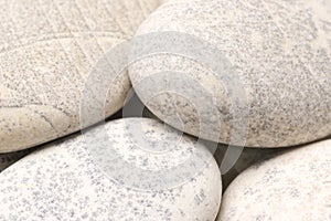 abstract background with dry round gray reeble stones gray close-up pebbles background spa relaxation concept