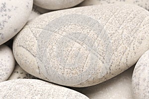 abstract background with dry round gray reeble stones gray close-up pebbles background spa relaxation concept