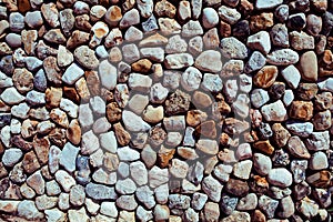 Abstract background with dry round stones make on wall