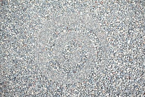 Abstract background of dry round stones in wide angle