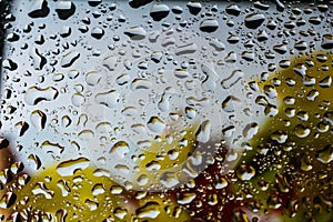 abstract background fall, glass drops autumn yellow leaves wet october weather