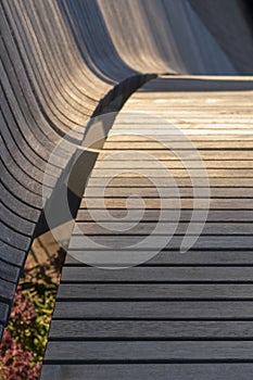 Abstract background with fragment of shaped wooden planks. Selective focus