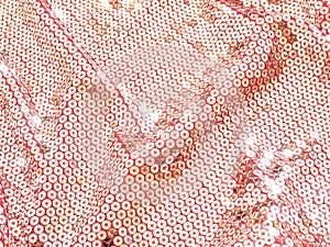 Abstract background glowing in the sun wavy pink fabric with silver sequins.