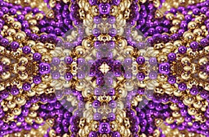 Abstract Background from Gold and Purple Beads Kaleidoscope