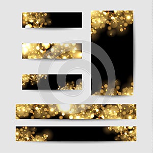 Abstract background with gold sparkles. Shiny defocused gold bokeh lights on black background.