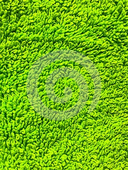 Abstract background of green terry cloth close-up