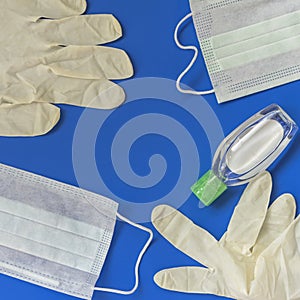 Abstract background of isposable face mask, hand sanitizer gel, medical gloves. Prevention items, hygiene concept