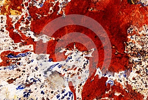 Abstract background. A large red spot on a white background covered with textures of blue brown shades.