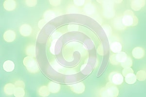 Abstract background. light celadon green blurry lights. bokeh. texture. concept for christmas, new year, holiday