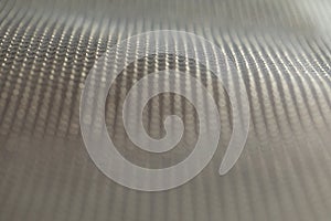 Abstract background of lots of grey pimples dots. Plastic surface with pimples