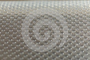 Abstract background of lots of grey pimples dots. Plastic surface with pimples