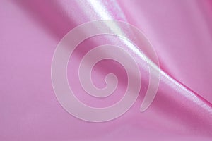 Abstract background of luxury pink wrinkled silk cloth, liquid waves, wavy folds for background texture