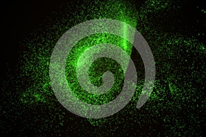 Abstract background made of green glowing particles in shape of an eye