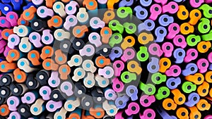 Abstract background of multicolored caps of plastic pens. A set of several liners, markers and colored markers of