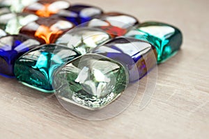 Abstract background multicolored multicolored glass cubes, crystals, transparent stones light wood