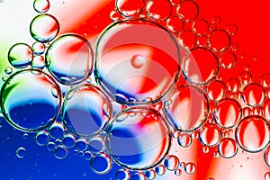 Abstract Background of Oil Bubbles on Water Surface red white blue palette