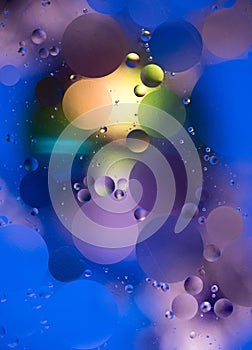 Abstract background, oil drops on water, bubbles, space fantasy, color gradient, color circles of oil on the water surface, rainbo