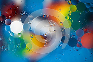 Abstract background, oil drops on water, bubbles, space fantasy, color gradient, color circles of oil on the water surface, rainbo