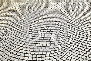 Abstract background of old cobblestone pavement close-up