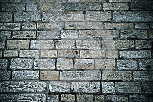 Abstract background of old cobblestone pavement. Grey stone brick paving texture. Close up of ancient road. Walking in an old city