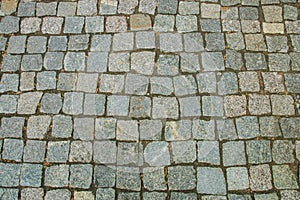 Abstract background of old cobblestone pavement view from above