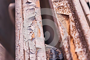 Abstract background, old cracked plaster wall, brown texture, paint stains and cracks. Peeling paint on wood, seamless texture.