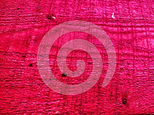 Abstract background with old wooden boards painted with red paint with texture and knots. Pattern, place for text and