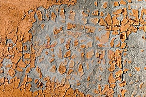 Abstract Background with Orange Paint Scrapings on a Wall photo