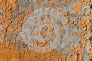 Abstract Background with Orange Paint Scrapings on a Wall photo