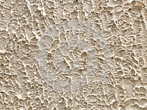 Abstract background of patterned earth wall.The strange hand-made clay wall surface