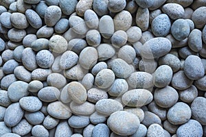 Abstract background from pebbles pattern on the beach. Natural a