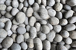 Abstract background from pebbles pattern on the beach. Natural a