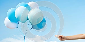 Abstract background with product discount promotion ideas. Woman hand pointing her finger at white and blue balloons in background