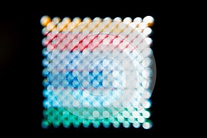 Abstract background, rainbow squared circles on black