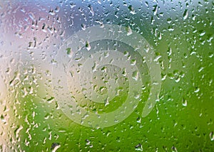 Abstract background with raindrops on glass.