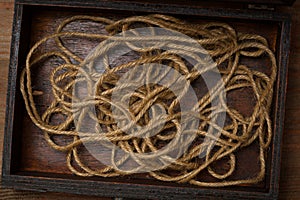 Abstract background of rope. the view from the top. Rope in an old box
