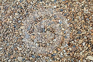 Abstract background with round pebble stones. Fine gravel, natural stones.