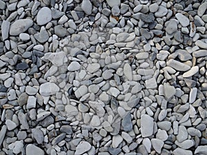 Abstract background with round peeble stones on sunny day