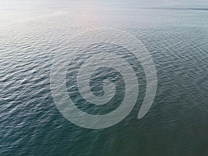 An abstract background of seawater flow under light exposure photo