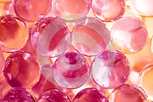 Abstract background with shiny water balls in violet and orange colors