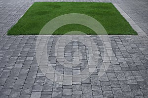 Abstract background with sidewalk and green grass in square form. Summer sun footpath garden paving stones landscape country
