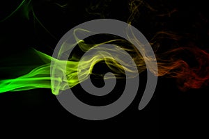 Abstract background smoke curves and wave reggae colors green, yellow, red colored in flag of reggae music